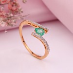 Gold ring with diamonds and emerald