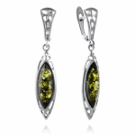 Silver earrings. Green amber