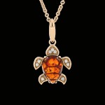 Gold-plated silver pendant "Turtle". Amber & Cubic Zirconia