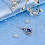White gold pendant with chain. Diamond and sapphire