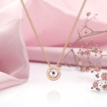 Ogrlica iz rožnatega zlata s smaragdom/rubinom