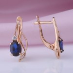 Earrings with spinel. Red gold