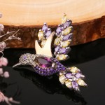 Zilveren broche met gouden "Kolibrie". Zirkonia & juweliersglas