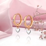 Gold earrings -Transformer "hearts". Zirconia