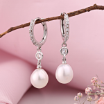 Gold earrings made of white gold with pearls zirconia