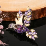 Silberbrosche mit goldenem „Kolibri“. Zirkonia und Schmuckglas