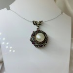Silver pendant with pearl and rubies