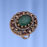 Silver ring with emerald, rubies