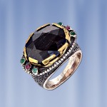 Ring with rubies and emeralds. Silver