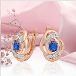 Brincos de ouro com diamantes e safira