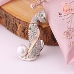 Silver brooch with gold, zirconia and pearl