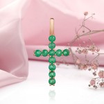 Golden cross pendant with emerald