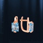 Boucles d'oreilles avec topaze. Or rouge