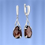 Silberne Ohrringe mit Anhänger. Rauchtopas