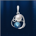 Pendentif avec perles et topazes. or blanc