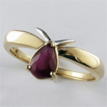 Golden ring with ruby