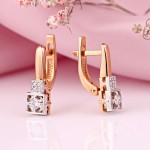 Gold earrings with diamonds. Bicolor