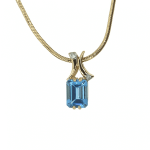 Golden pendant with topaz and diamonds
