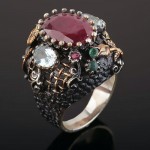 Silver ring. Rubies, emeralds
