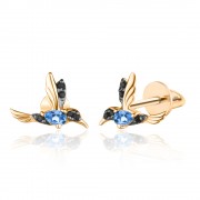 Pendientes de oro con colibríes y topacio azul y pendientes negros.