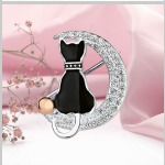 Broche en argent avec "Chaton" en or. Zircone