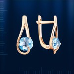 Earrings with topaz. Red gold