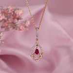 Gold pendant with chain. Diamonds and ruby