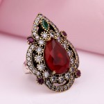 Silver ring with rubies, zirconia and emerald