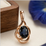 Pendant with sapphires. Red gold