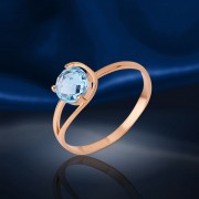 Ring with topaz. Red gold