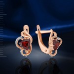 Earrings with garnet. Red gold