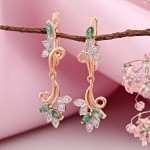 Boucles d'oreilles en or avec émeraudes et diamants