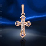Gold cross pendant with crucifix. Sapphires