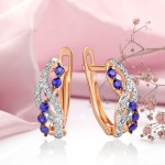 Gold earrings "The Wave". Diamonds and sapphire