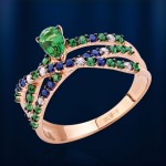 Gold ring with sapphire and emerald