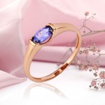 Red gold ring with tanzanite