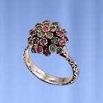 Silver ring with emerald and rubies