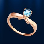 Gold ring with topaz. Red gold