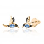 Pendientes de oro con colibríes y topacio azul y pendientes negros.