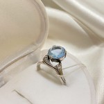 Silver ring with topaz and zirconia