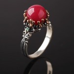Silver ring. Rubies, emeralds