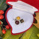 Silver ring with amber. Tricolor