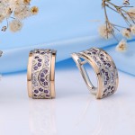 Silver earrings with gold inserts. Zirconia