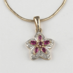Gold pendant with rubies and diamonds