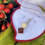 Silver pendant with bicolor amber
