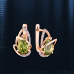 Russian earrings with chrysolite. Red gold