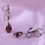 Silberne Ohrringe mit Anhänger. Rauchtopas